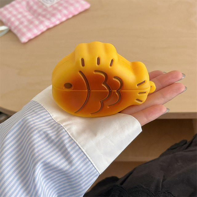 Silikon Schutzhülle im Taiyaki Cartoon Design für Apple AirPods 4, Gelb, inklusive Anhänger - Bild 1