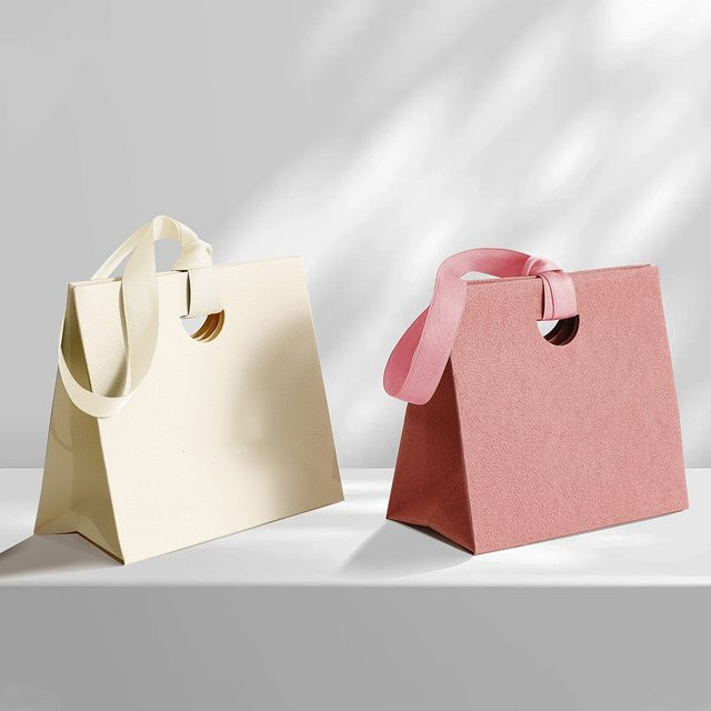 Hochwertige Papierhandtaschen mit Griffen für Schmuck und Geschenke in Rot und Beige - Bild 1