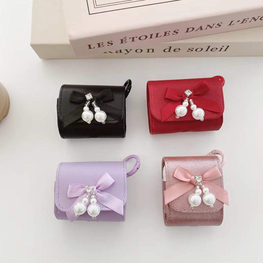 Elegante Kopfhörer-Hülle für Apple AirPods 1, 2, 3, 4 und Pro 2 aus Kunstleder mit süßer Perlen-Bowknot-Dekoration und Haken in Pink - Bild 2