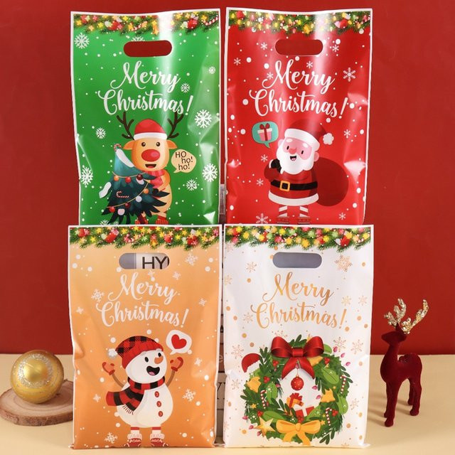 Bunte Weihnachts-Geschenkverpackung aus Papier mit Weihnachtsmann, Schneemann und Elch Motiven - Bild 1