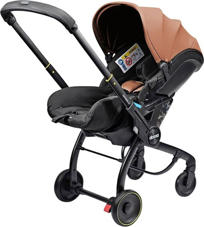 Doona Babyschale Doona X in Braun mit Isofix und Base nach i-Size Standard