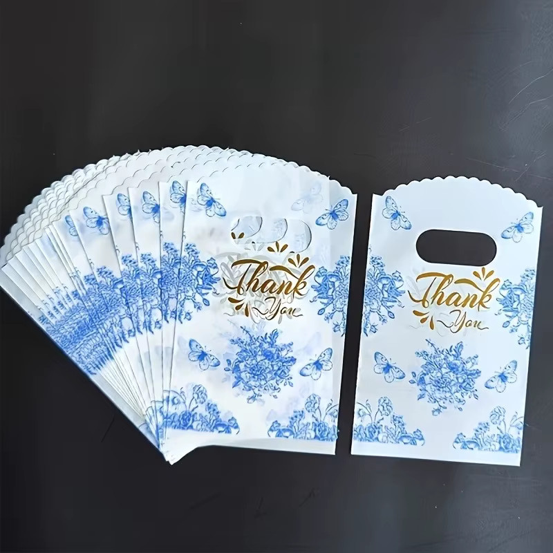 Blaue Geschenktüten aus Papier mit Schmetterlingsdruck und Blumenmuster für besondere Anlässe und Partys - Bild 3