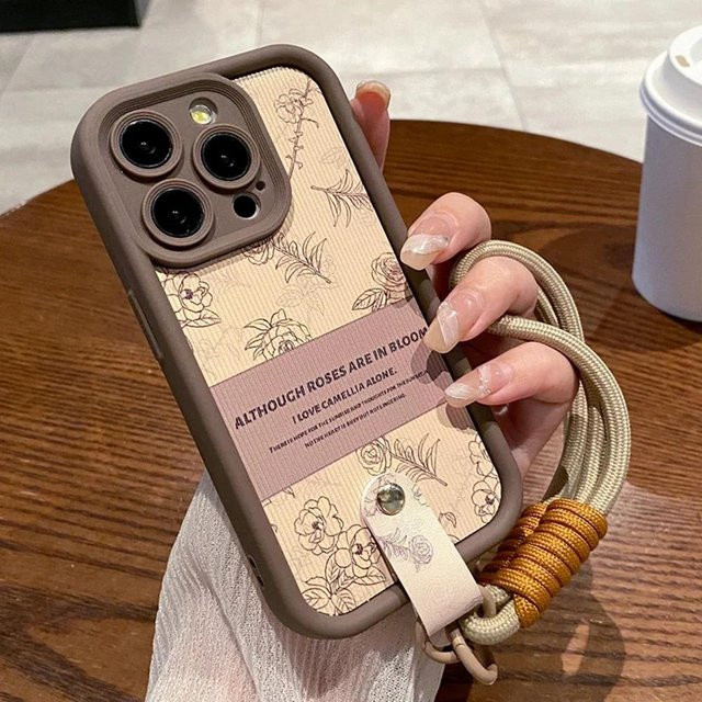 Yiran Silikon Handyhülle mit Kamelien-Design und Handgelenkschlaufe für iPhone 11 12 13 14 15 16 Pro Max Plus X XR XS in Grau - Bild 1