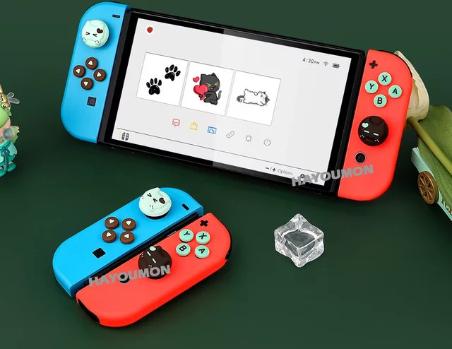 Pogopirate Katzen-Joystickschutzkappen und ABXY-Tasten-Aufkleber-Set für Nintendo Switch und Switch Lite, Multicolor - Bild 1