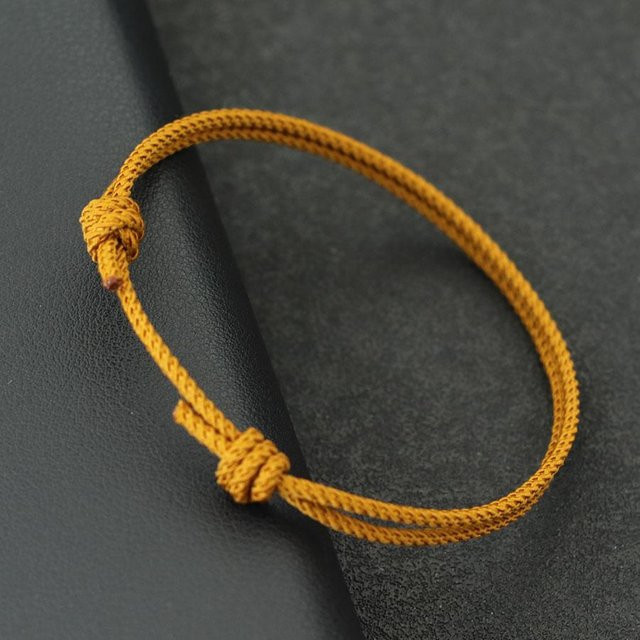 Schnurarmband, Nylon, dunkel gelb, Unisex - Bild 1