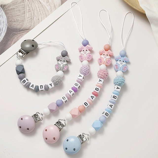 BPA-freier Baby Schnuller Clip aus Silikon mit Kaninchen-Design als Beißspielzeug in Blau und Mehrfarbig - Bild 1