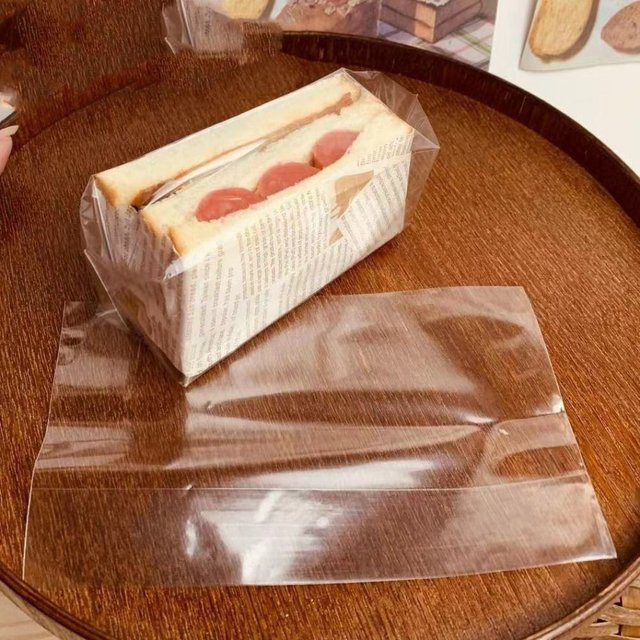 100 Stück transparente Sandwich-Verpackungstaschen aus Kunststoff mit Selbstklebe-Abdichtung für Lebensmittel und Hamburger - Bild 1