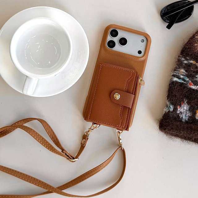 Brieftaschen-Handyhülle mit Riemen und Kartenfächern für Apple iPhone in Schwarz oder Braun aus PU-Leder und Silikon - Bild 1
