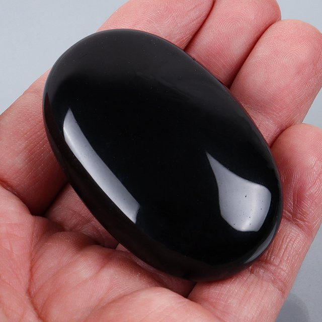 Muyijaderies Massagehandstein Obsidian, Selenit, Unisex - Bild 1