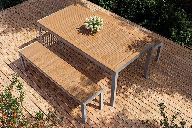 OUTFLEXX Falun Garten-Essgruppe aus Edelstahl und Teakholz in Braun/Silber mit Tisch und 2 Bänken, Tisch B/T: 180 x 90 cm, Höhe: 75 cm, Bänke B/H: 160 x 38 cm, Höhe: 38 cm - Bild 1