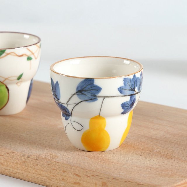 Handgezeichnete Keramik-Teetasse mit Kürbis-Design in Mehrfarbig - Bild 1