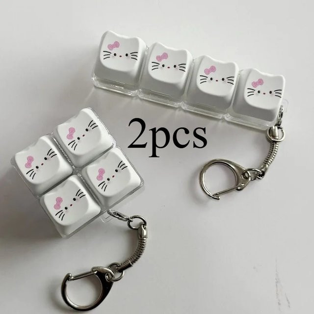 Sanrio Hello Kitty Kawaii Leuchtender Fidget-Schlüsselanhänger, Niedliches Katzenohr-Tastatur-Drückspielzeug, Im Dunkeln Leuchtender Stressabbau-Taschenanhänger - Bild 1