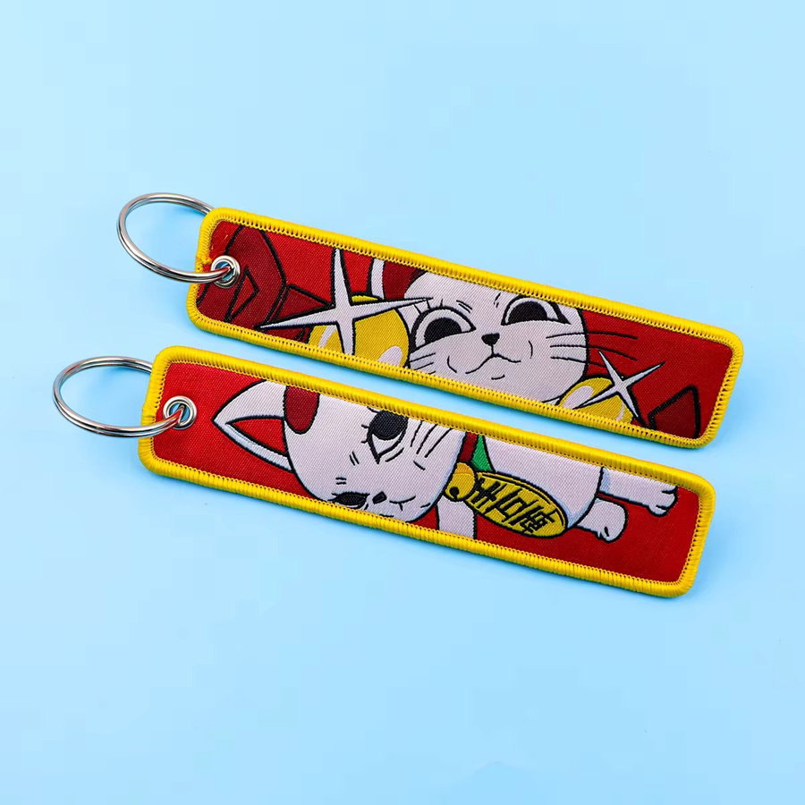 YiYuYiHua Schlüsselanhänger Manga Lucky Cat Stickerei, Unisex - Bild 1