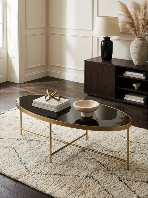 Ovaler Couchtisch von KADIMA DESIGN aus schwarzem Glas mit goldfarbenem Metallgestell, B/T/H: 110 x 56 x 40 cm - Bild 1
