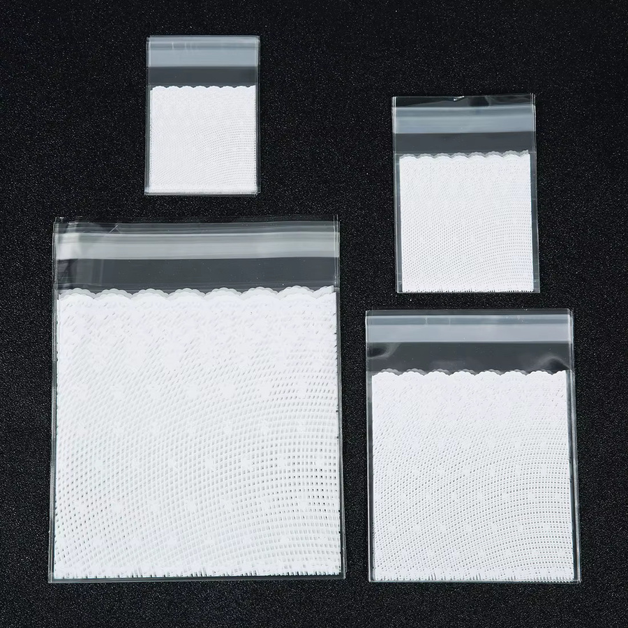 100 Stück selbstklebende OPP-Geschenktüten mit weißem Spitzenbesatz, wiederverschließbare Kunststoffbeutel für Hochzeiten, Geburtstage und Partys, transparent/weiß - Bild 2