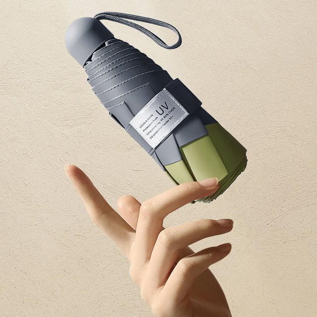 HUIJI Mini-Regenschirm mit 8 Rippen, winddicht und mit UV-Schutz, tragbarer Faltregenschirm inklusive Tasche für Damen und Kinder - Bild 1