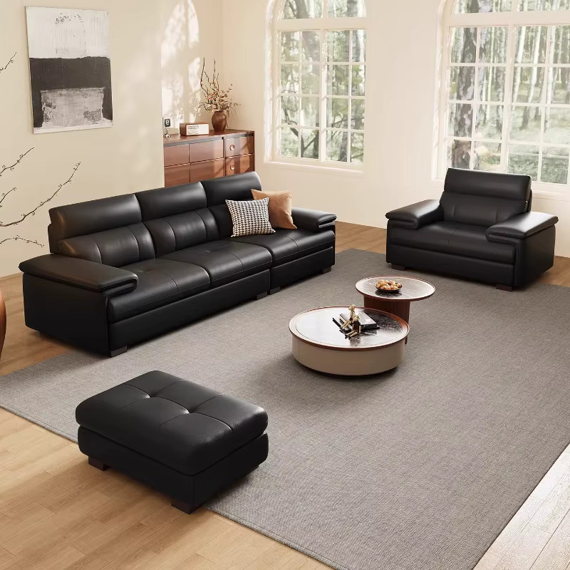 Minimalistisches Sofa aus echtem Leder in Schwarz mit passendem Ottoman für dein Wohnzimmer - Bild 1