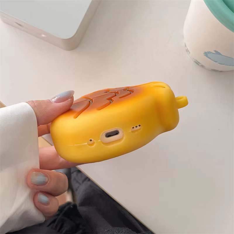 Silikon Schutzhülle im Taiyaki Cartoon Design für Apple AirPods 4, Gelb, inklusive Anhänger - Bild 2
