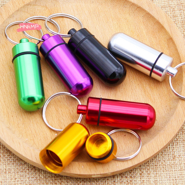 HNKMP Mini-Schlüsselanhänger Pillendose aus Aluminium, wasserdichte Medikamentenbox in Gold und Multicolour - Bild 1