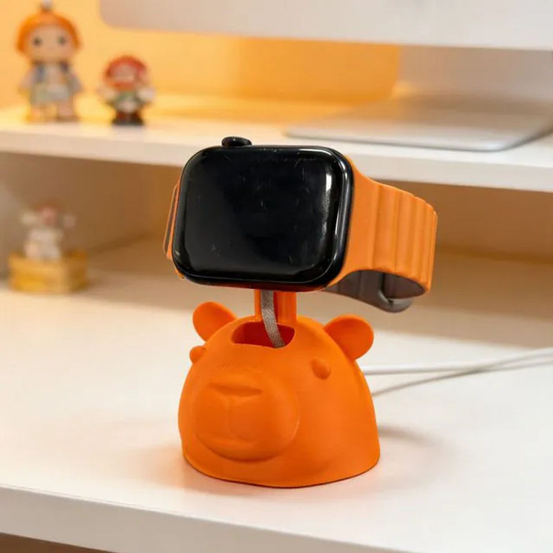 Niedlicher 3D-gedruckter Capybara-Ladeständer aus Kunststoff in Grün und Orange als Schreibtischdekoration - Bild 1