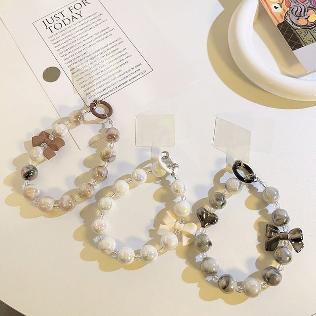 Luxus Handyband im koreanischen Design als modischer Handy-Anhänger in Schwarz, Silber und Beige - Bild 1