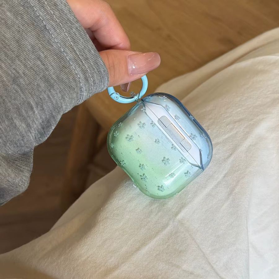 Transparente Kopfhörer-Schutzhülle für Apple AirPods 1, 2, 3, 4 und Pro/Pro 2 mit blau-grünem Farbverlauf und Blumenmuster - Bild 2