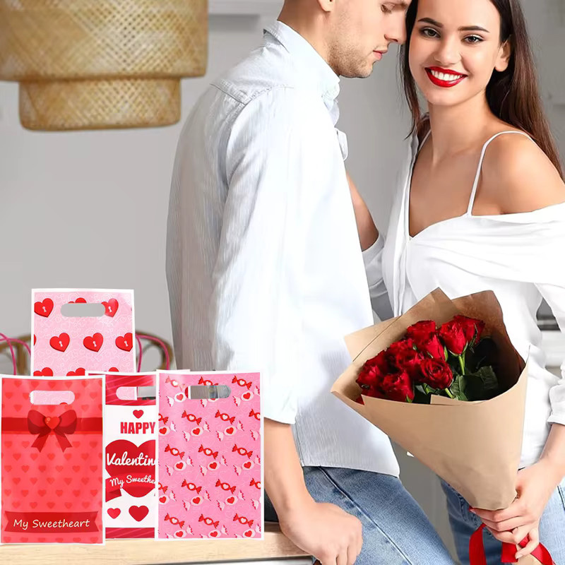 50 Stück rosa Kunststoff-Geschenktüten mit Herzdesign für Valentinstag und Hochzeitsdekoration - Bild 2