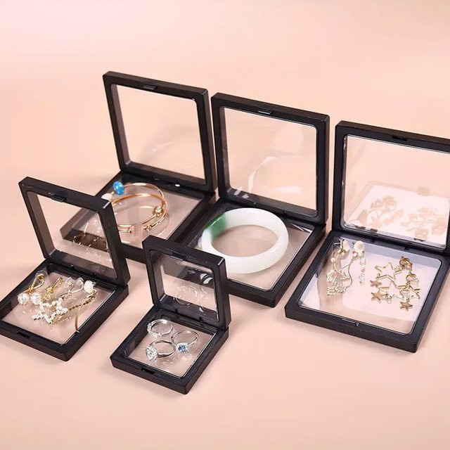 10 Stück Transparente Schwebe-Displayboxen aus Kunststoff für Schmuck, Ringe und Münzen in Schwarz - Bild 1