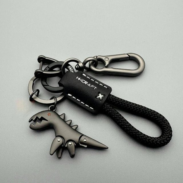 Velishy Schlüsselanhänger Dinosaurier, Leder-Geflechtseil, Metall, Unisex - Bild 1
