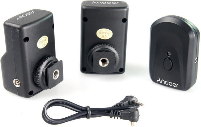 Andoer 4-Kanal Wireless Fernblitzauslöser Set mit 1 Sender und 2 Empfängern in Schwarz, kompatibel mit Canon, Nikon, Sigma, Olympus und Pentax - Bild 1