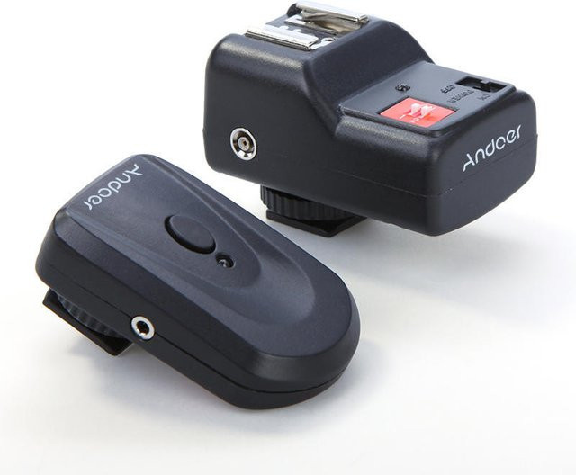 Andoer Wireless Remote Speedlite Blitzauslöser mit 4 Kanälen in Schwarz für Canon und Nikon - Bild 1