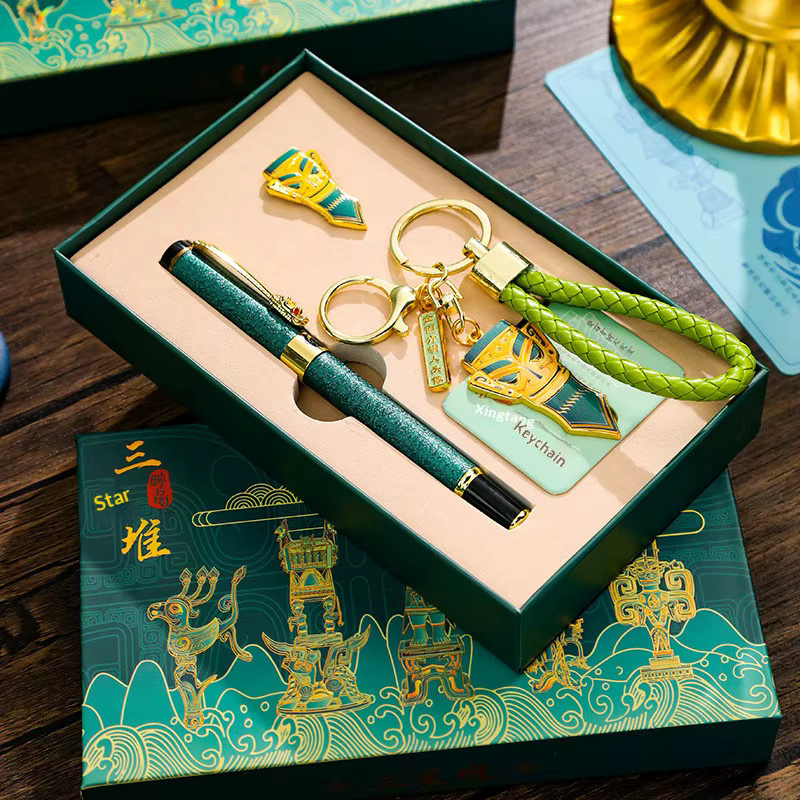 Sanxingdui Schlüsselanhänger und Gelstift-Set aus Messing mit Bronzekopf-Ornament und schwarzer Tinte in Gelb und Multicolour - Bild 2