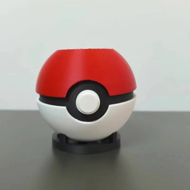 TAKARA TOMY Poke Ball Stifthalter Desktop-Aufbewahrungsbox in Rot und Gelb - Bild 1