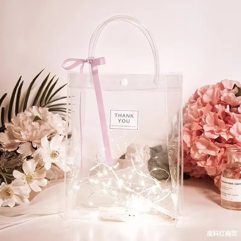 Transparente Geschenktüten aus weichem PVC mit Handschlaufe als durchsichtige Kunststoff-Kosmetiktasche in der Farbe Transparent - Bild 1