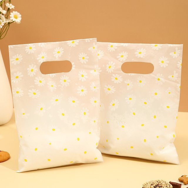 100 Stück Gänseblümchen-Geschenktüten aus Kunststoff mit Griff in Weiß - Bild 1