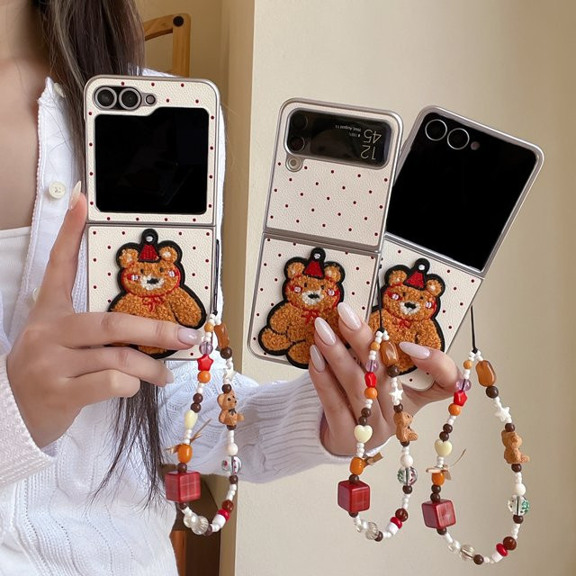 Samsung Galaxy Z Flip 3 4 5 6 7 Handyhülle aus Leder mit gesticktem Cartoon-Bär und Umhängeband in Silber und Beige - Bild 1