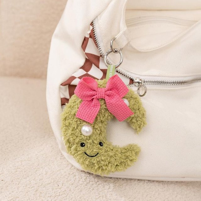 Yiran toy Plüschtier, grüner Kranz, rosa Fliege, Plüsch / Textil - Bild 1