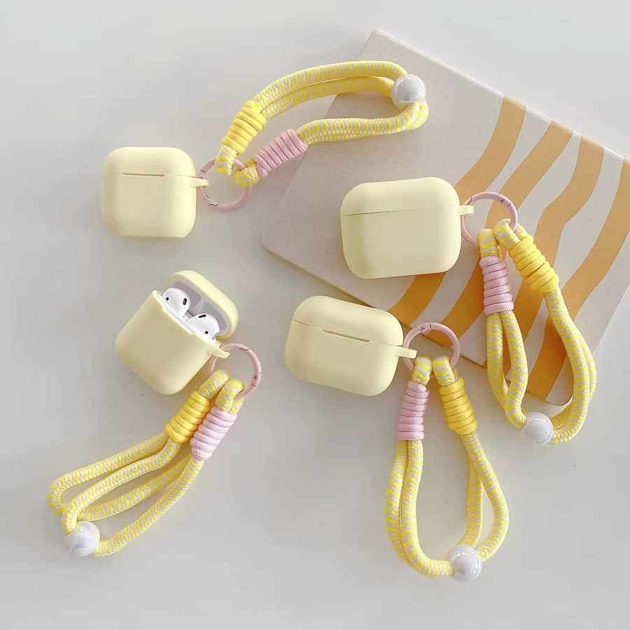 Milchgelbe Silikon-Softshell-Hülle mit matter Textur und Perlen-Lanyard für Apple AirPods 2 3 4 Pro Pro2 Pro3 in Beige - Bild 2