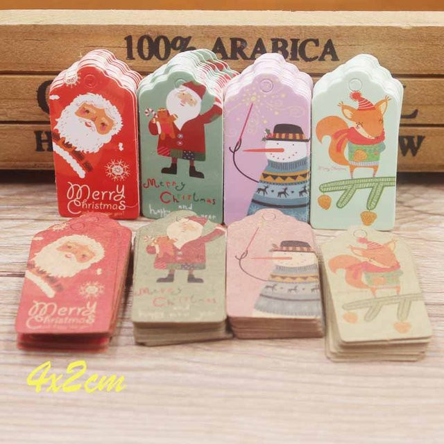 100 Stück Frohe Weihnachten Geschenketiketten aus Kraftpapier in Braun, B: 4 cm, H: 2 cm - Bild 1