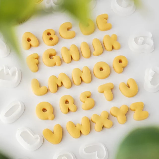 Mini-Keksform Set mit 26 englischen Großbuchstaben aus Kunststoff in Gelb - Bild 1