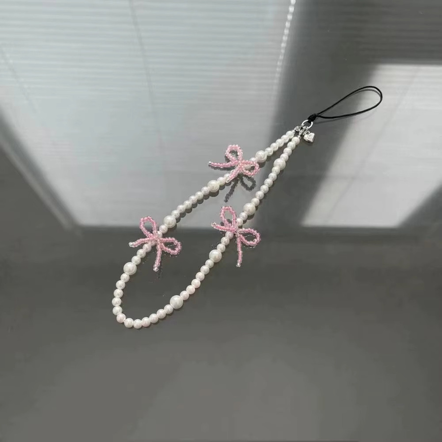 Rosa Perlen-Handylanyard mit Schleife und Perlenanhänger für iPhone als Schmuck-Zubehör für Damen und Mädchen - Bild 2