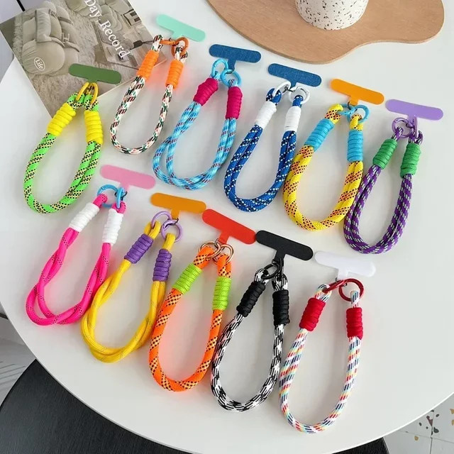 Fashion Weave Handy Lanyard für iPhone 17 Pro Max, Anti-Verlust Handgelenkstrap als dekoratives Twist-Seil in Schwarz und Weiß - Bild 1