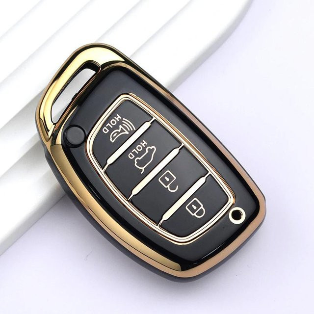 Schlüsselhülle aus TPU für Hyundai Tucson, Santa Fe, Sonata, Elantra, Creta, Ix35, Ix45, I10, I30, I40 mit 4 Tasten in Schwarz und Gold - Bild 1