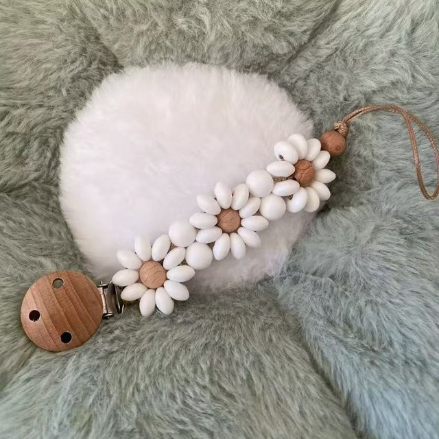 Bebe Schnuller-Clip-Halter aus Silikon in Weiß mit Gänseblümchen-Beißring für Babys und Kleinkinder - Bild 1