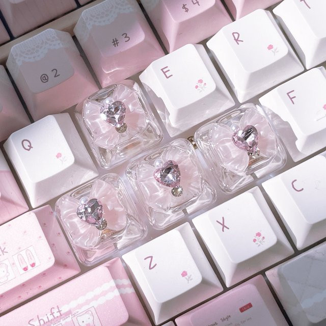 Sanrio Schmetterlings-Tastenkappen Set aus 4 Stück, pink und transparent, bogenförmige DIY-Tastenkappen für mechanische Tastaturen mit Hintergrundbeleuchtung - Bild 1