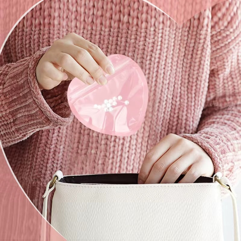 20 Stück herzförmige Schmuckbeutel in Rosa, wiederverschließbare Druckverschlussbeutel aus Kunststoff für Hochzeit und Valentinstag - Bild 3