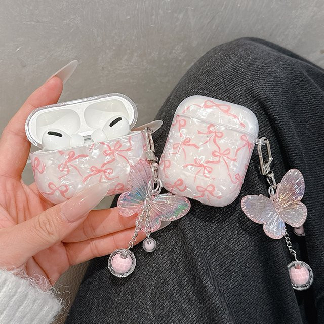 Schutzhülle mit Glitzer-Schleifenmuster und Kristall-Design für Apple AirPods Pro 2, 2. Generation sowie AirPods 1, 2, 3 und 4, transparent/beige - Bild 1