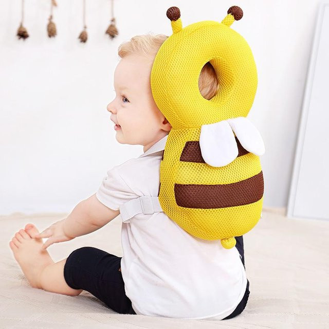 Fashnics Kopf-Rückenprotektor Baby Schutzkissen in Gelb mit Cartoon Biene aus Baumwolle zur Verletzungsprävention und zum Sturzschutz beim Laufenlernen - Bild 1