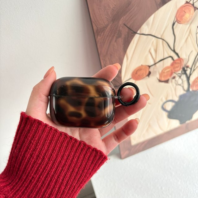 Retro Schutzhülle für Apple AirPods (1, 2, 3, 4, Pro, Pro 2) in Braun mit Bernstein-Muster und Haken - Bild 1