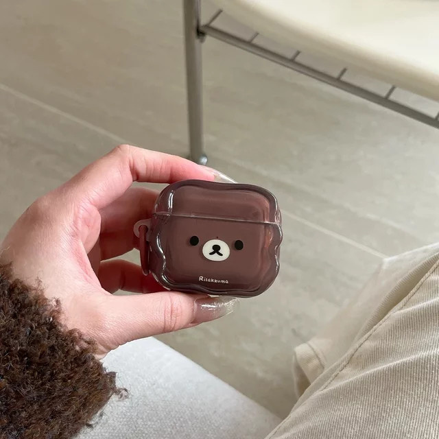 Schutzhülle für Apple AirPods 4, 3, 2, 1 mit niedlichem Rilakkuma-Bär Design in Braun inklusive Schlüsselanhänger - Bild 1